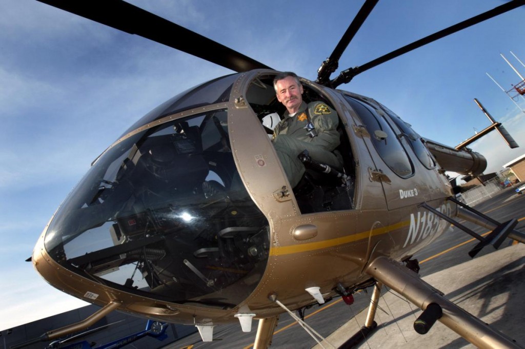 medal.p0318 --- 03/16/05 --- Photo by: H. Lorren Au Jr. / The Orange County Register. Helicopter pilot Deputy David Tilstra in the Boeing MD600N helicopter he was piloting when he was shot. He is winning a purple heart medal and medal of valor Friday at a Sheriff's Department banquet. Tilstra was the Orange County Sheriff Department pilot who continued tracking a gunman in Baker Canyon in June for an hour after being shot in the leg. (*confirm above with story. Not written as of now. txs, Lorren)