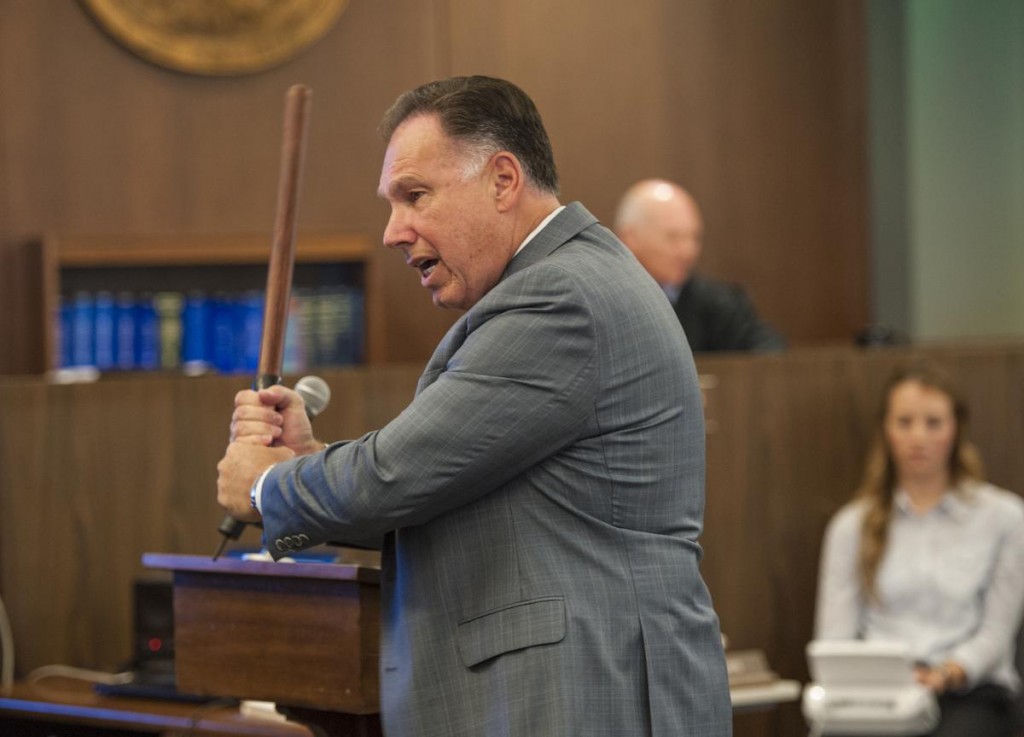 During his opening statements in the People v. Ramos and Cicinelli trial, Orange County District Attorney Tony Rackauckas wields a police baton, demonstrating how he believes Fullerton police officer Manuel Ramos threatened Kelly Thomas. ////ADDITIONAL INFO: kelly.thomas.120213 - Day: Monday - Date: 12/2/13 - Time: 10:17:38 AM - Original file name DSC_0409.NEF PHOTO BY, BRUCE CHAMBERS, ORANGE COUNTY REGISTER - SANTA ANA - A history-making trial starts Monday for two ex-Fullerton police officers accused in the beating death of a mentally ill, homeless man. At stake will be the freedom of former officers Manuel Ramos, 39, and Jay Cicinelli, 42, who are charged with fatally beating Kelly Thomas, 37, a schizophrenic transient, during an encounter captured by a surveillance camera at the Fullerton Transportation Center on July 5, 2011. Thomas died five later when he was removed from life support, Ramos, 39, is charged with second-degree murder and involuntary manslaughter  the first time in Orange County history that a uniformed police officer has been charged with murder for an on-duty incident. Cicinelli, 41, is charged with involuntary manslaughter and assault and battery under color of authority. The trial before Superior Court Judge William Froeberg could take about six weeks.The prosecution is led by Tony Rackauckas, Orange County's district attorney since 1999, the first time in more than a dozen years that he's personally handled a trial in the courtroom. John Barnett, perhaps the county's best-known defense attorney, is representing Ramos. Michael Schwartz, who specializes in defending police officers, is representing Cicinelli.