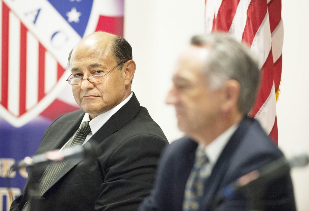 Former state Senator Lou Correa listens to Joe Dunn during a debate of candidates seeking to replace outgoing Rep. Loretta Sanchez at the League of United Latin American Citizens in Garden Grove Saturday. ///ADDITIONAL INFO: congress.1018.kjs --- Photo by KEVIN SULLIVAN / Orange County Register -- 10/17/15 Coverage of a debate for candidates seeking to replacing outgoing Rep. Loretta Sanchez, D-Orange. 10/17/15