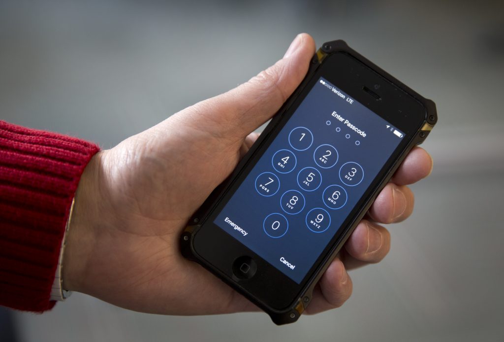 FILE - This Feb. 17, 2016, file photos shows an iPhone in Washington. The government hack of an iPhone used by a San Bernardino killer serves as a reminder that phones and other electronic devices arent impenetrable vaults. While most people arent in danger of being hacked by the NSA, FBI or a foreign government, there are hackers out there looking to steal the financial and personal information of ordinary people. (AP Photo/Carolyn Kaster, File)