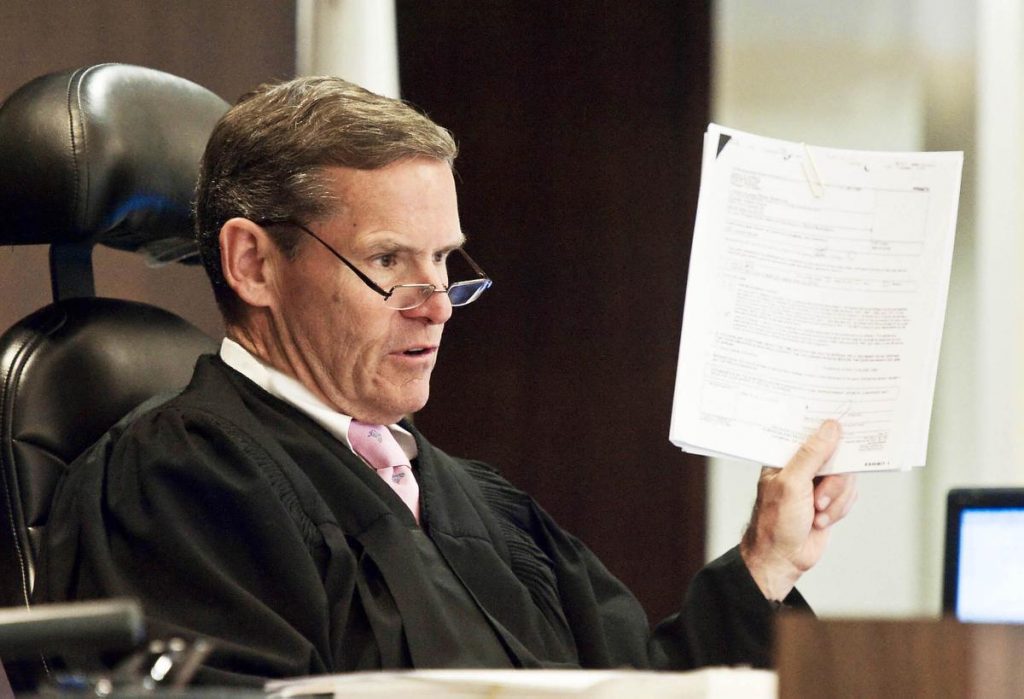 Judge Thomas Goethals discusses the admissibility of previously sealed court documents related to an alleged jailhouse informant who may have assisted in the conviction of Henry Rodriguez, who has spent 15 years in prison for his role in the 1998 murder of a pregnant woman and her unborn child. ///ADDITIONAL INFO: RODRIGUEZ.0626 - 6/25/15 - PHOTO BY JOSHUA SUDOCK, STAFF PHOTOGRAPHER - Henry Rodriguez, who has spent 15 years in prison for his role in the 1998 murder of a pregnant woman and her unborn child, appeared in a Santa Ana courtroom with his attorney, James Crawford, and deputy district attorneys Howard Gundy and Eric Scarbrough on Thursday to discuss alleged misuse of jailhouse informants by Orange County prosecutors in his case. Judge Thomas Goethals' decision could lead to a new trial or the outright prisoner release. Picture made at The Orange County Central Justice Center, department C45, in Santa Ana, California, on Thursday, June 25, 2015